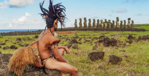 Native Rapa Nui man in tradititional costume and Moais in Ahu Tongariki, Rapa Nui National Park, UNESCO World Heritage Site, Easter Island, Chile, South America ©Karol Kozlowski/robertharding.com