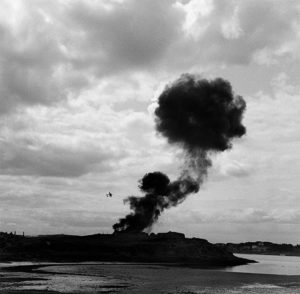 Fall of Citadel: The black cloud of smoke mounts high after first bombs have been dropped by P38s, St Malo, France 1944 © Lee Miller Archives