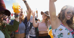 Young crowd dancing at summer music festival ©Alamy Stock Photo