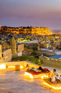 India, Rajasthan, Jaisalmer, View of Jaisalmer city by night from an outdoor cafe ©Maurizio Rellini/4Corners Images