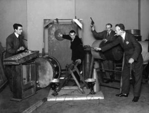 The BBC Sound Effects Department making effects for a programme in a radio studio, 1927 ©BBC Photo Library