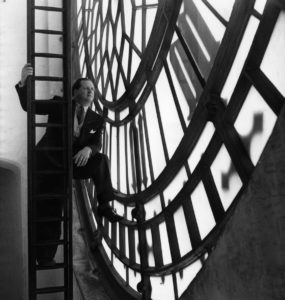 Richard Dimbleby inside the clock-face of Big Ben during a filming session for the first programme of London Town, 1949 ©BBC Photo Library