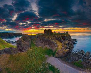United Kingdom, Scotland, Aberdeenshire, Stonehaven, Dunnottar Castle, Great Britain, British Isles, Colorful sunrise on Dunnottar castle along the Scotland coastline