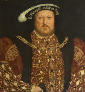 Oil painting on panel, King Henry VIII (1491-1547), after Hans Holbein the younger (Augsburg 1497/8 - London 1543), 16th century. A half-length portrait in richly embroidered brown coat, jewelled and feathered black cap, jewelled gold neck chain of H design and jewelled medallion. Holding leather gloves in his right hand, ring on index finger. Frame has gilt label 'Henry VIII, Holbein'. Picture light attached to back of frame. One of several copies of a lost original. From Newbattle Abbey.