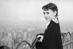 Audrey Hepburn on a 1952 visit to New York, USA where she was starring in Gigi on Broadway, New York 1952. She is at the top of the Rockerfeller Tower on the viewing platform overlooking the Manhattan skyline. Credit: George Douglas / TopFoto