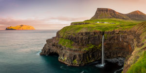 Denmark, Faeroe Islands, Vágar, Scandinavia, Gasadalur, the iconic waterfall jumping from the cliff into the ocean