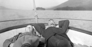 Wilson and Nelstrop asleep on a boat on Coniston, Lake District, or more likely pretending to sleep - another photograph giving the lie to Edwardian conformity. Date: circa 1907