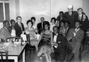 The gathering of 15 men and women from Nottingham's diverse communities at the British Consulate in Nottingham. Table left of picture with glasses and drinks. Date: 1960s