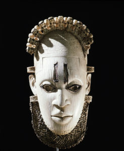 An ornamental hip mask. The headdress is surmounted with small heads of Portuguese. Country of Origin: Nigeria. Culture: Benin. Date/Period: early 16th c.. Place of Origin: Benin. Material Size: Ivory, h=25cms.